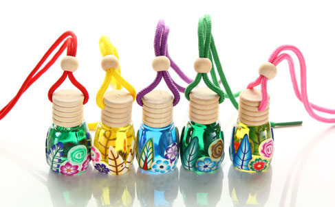 PERFUME BOTTLES PUT ON THEIR FANTASTIC COATS